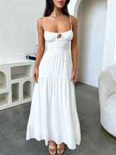 Woman wearing tiered lace up spaghetti straps maxi dress with smocked bodice