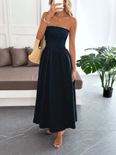 Woman wearing a slightly stretchy smocked tube maxi dress made of 100% polyester, shown in multiple sizes and measurements.