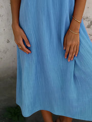 Full Size Short Sleeve Shirt Dress with Collar Plus Size in blue fabric, showcasing the dress design and texture.